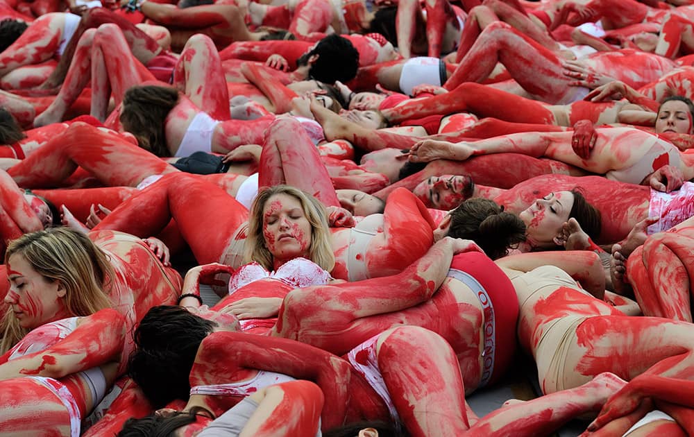 Animal rights activists lay on the ground covered in fake blood during a protest against animal suffering and meat consumption as part of the World Day for the Abolition of Meat in Paris, France.