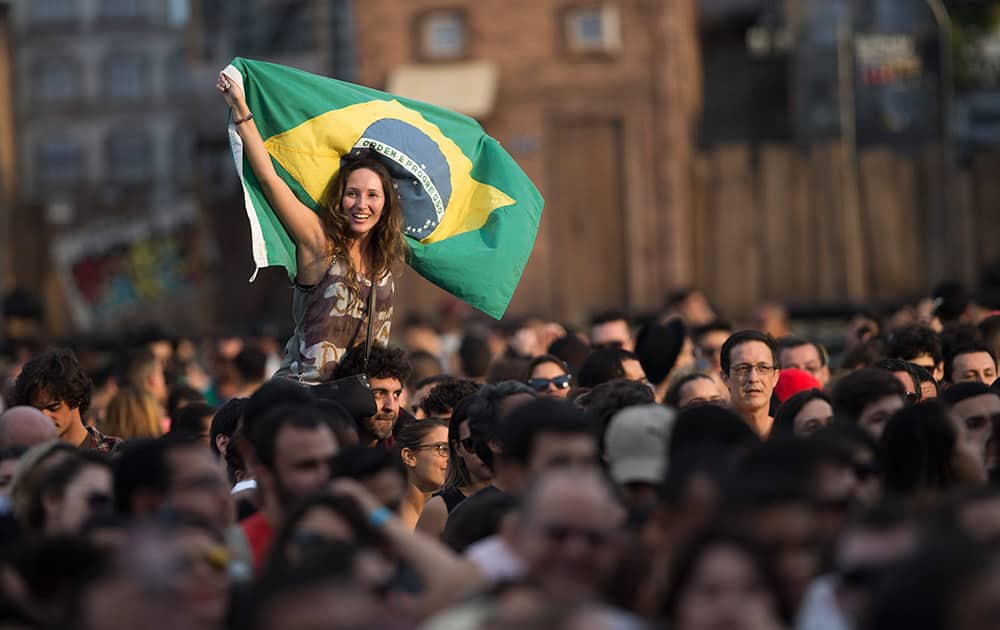 A fan holds a Brazilian flag during the Ultraje a Rigor show at the Rock in Rio music festival in Rio de Janeiro, Brazil.