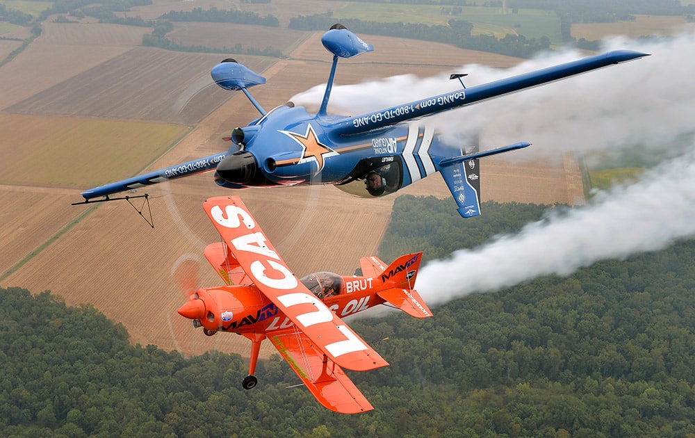 John Klatt and the Air National Guard MXS (top) and Mike Wiskus and the Lucas Oil Pitts take to the skies at the Memphis Airshow, in Millington, Tenn.