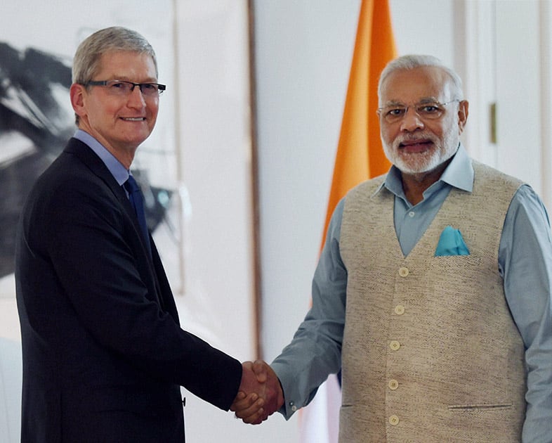 Prime Minister Narendra Modi shakes hands with Tim Cook, CEO Apple Inc. at a meeting in San Jose.