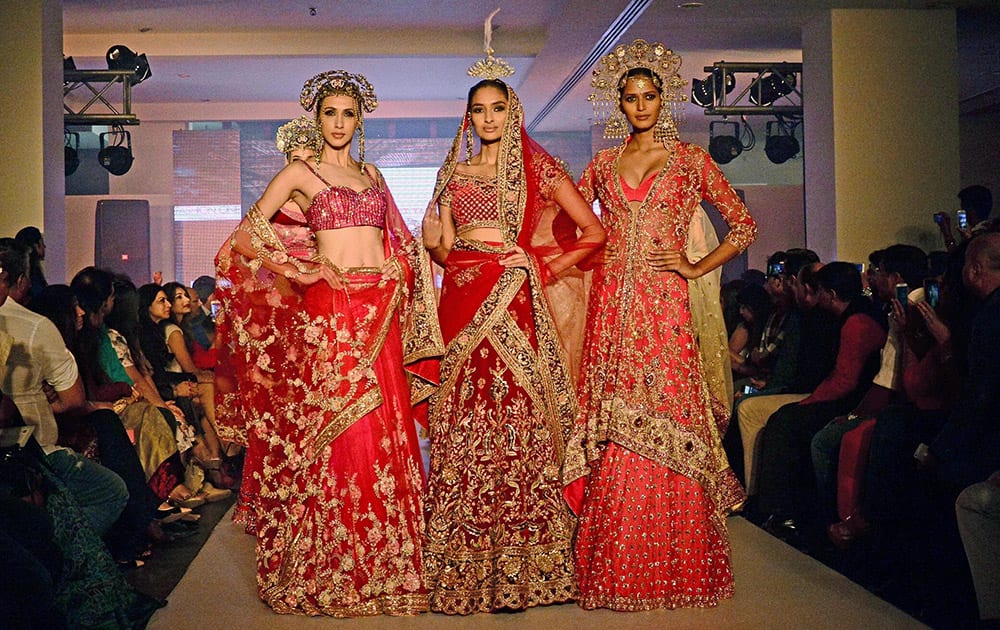 Models displays the wedding creation of designer Suneet Verma BMW bridal fashion week in Ahmedabad.