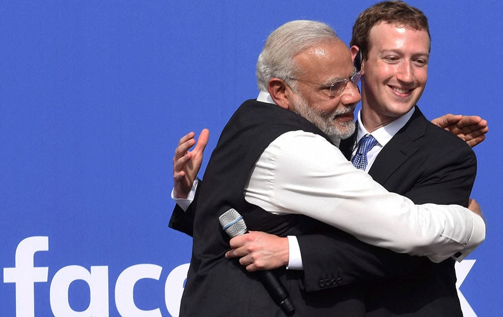 Prime Minister Narendra Modi hugs CEO of Facebook, Mark Zuckerberg at Facebook headquarters in California.
