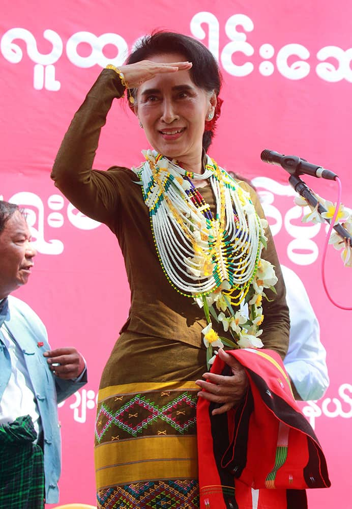 Myanmars opposition leader Aung San Suu Kyi looks at supporters of her National League for Democracy party.