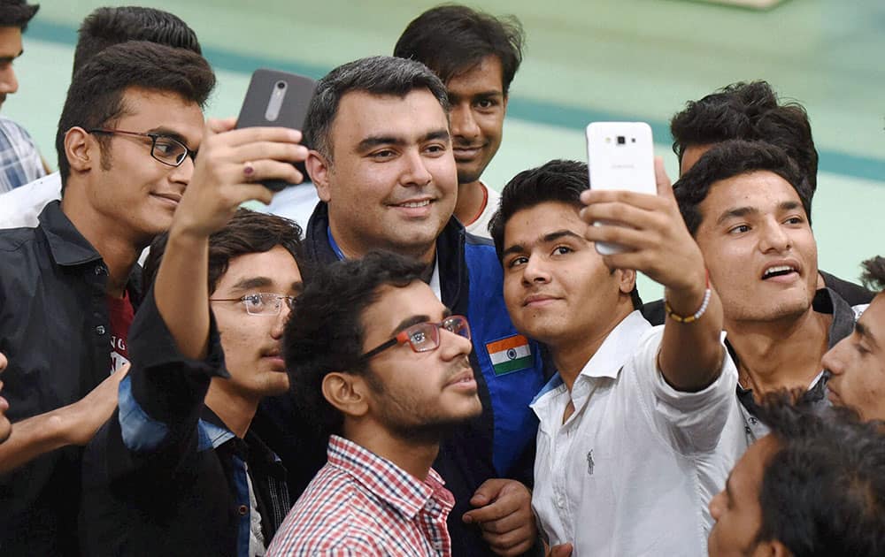 Fan taking selfies with ace shooter Gagan Narang at 8th Asian Air Gun Championship in New Delhi.
