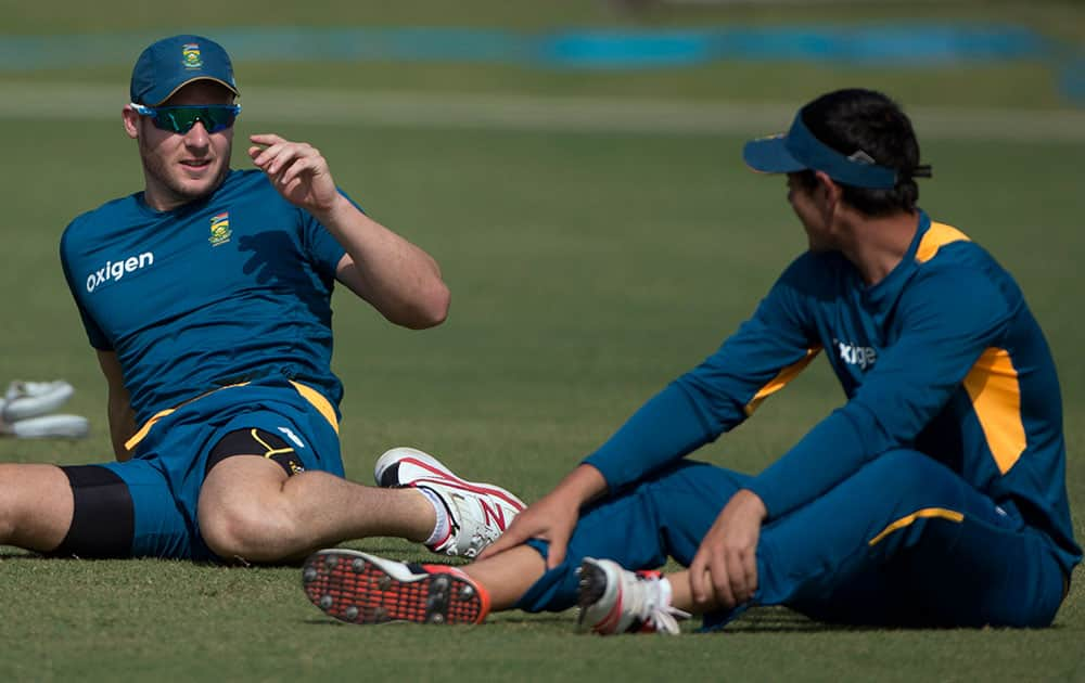 South African player David Miller talks to a teammate during a practice session in New Delhi, India.