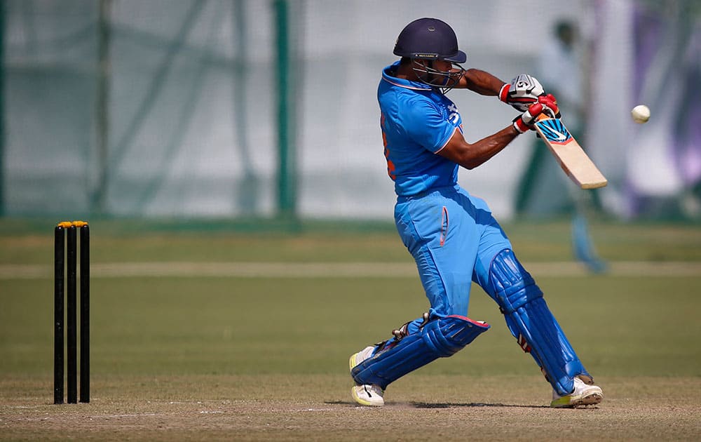 India A's batsman Mayank Aggarwal hits a ball against South Africa during a practice Twenty20 match in New Delhi.