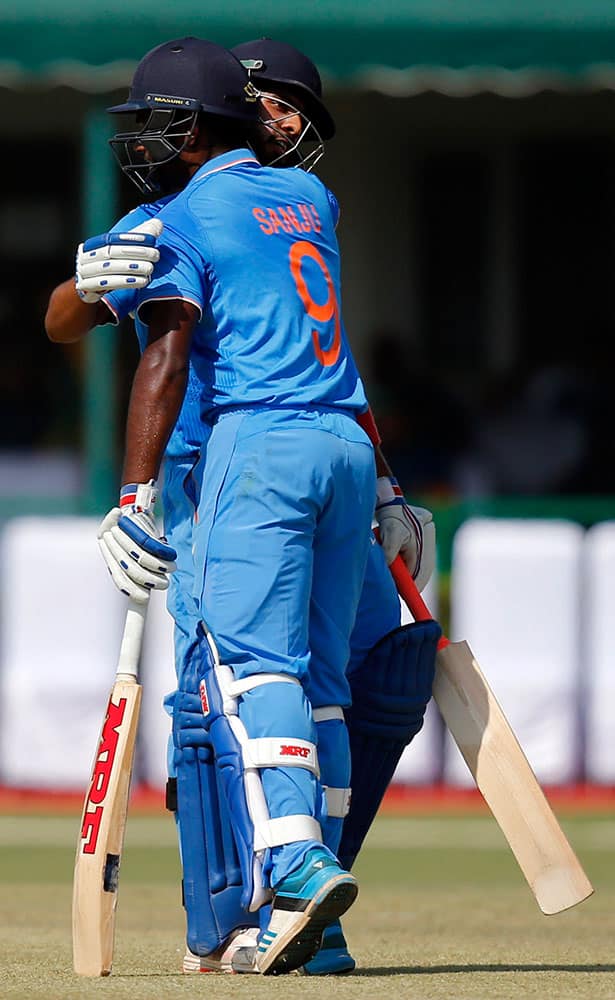 India A team captain Mandeep Singh hugs Sanju Samson after winning the practice match against South Africa in New Delhi.