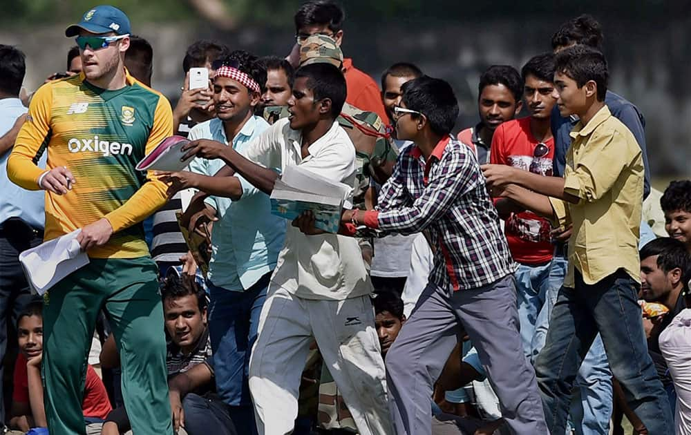 South African player Miller giving autograph to his fans during their T20 practice match at Sports Complex Air Force Station, Palam in New Delhi.