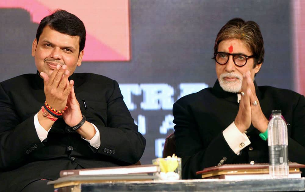 Chief Minister of Maharashtra, Devendra Fadnavis with actor Amitabh Bachchan at the launch of a Coffee Table book on Maharashtra Cuisine and unveling of a mobile app Maha Explore, in Mumbai.