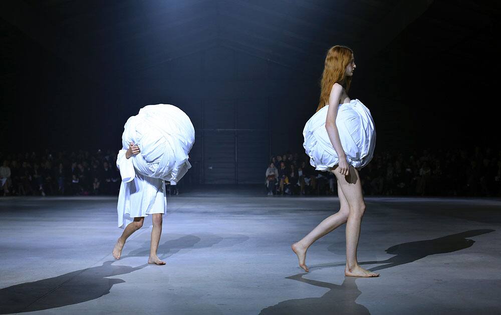 Models wear creations by French designer Simon Porte for Jacquemus, as part of his Spring-Summer 2016 ready-to-wear fashion collection, in Paris.