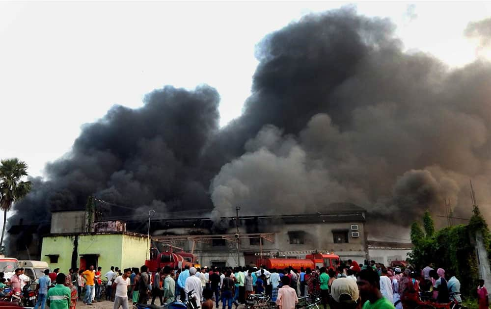 Smoke billowing out of a medicine factory after a fire at Rajarhat in North 24 Pargana district of West Bengal.
