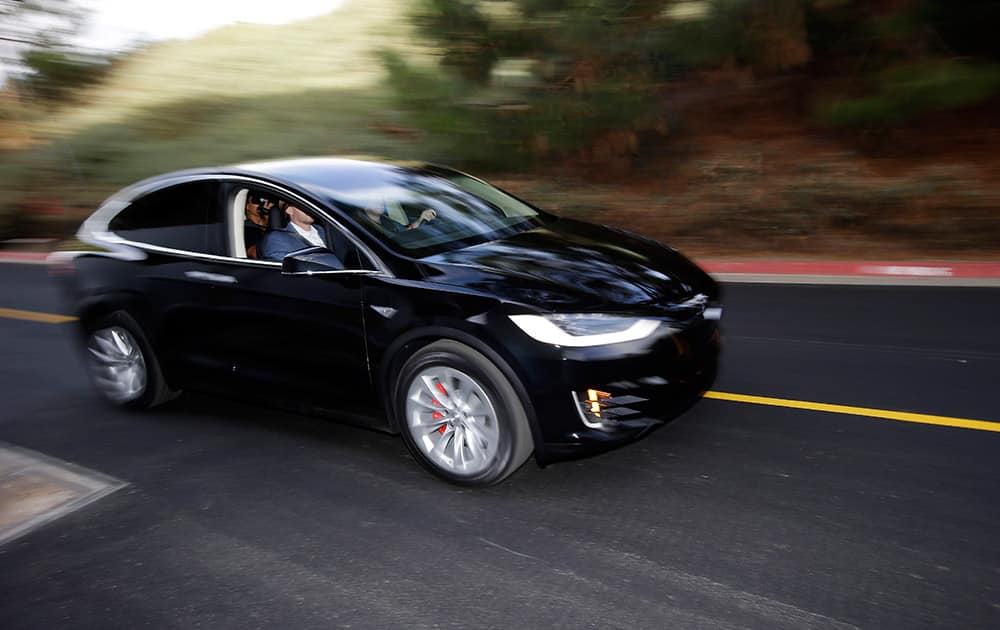 The Tesla Model X car is test driven at the company's headquarters, in Fremont, Calif.