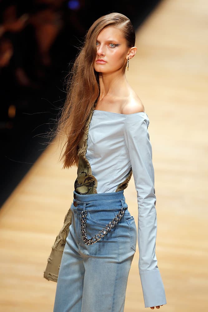 A model wears a creation for Guy Laroche by U.S. designer Adam Andrascik as part of his Spring-Summer 2016 ready-to-wear fashion collection, presented during the Paris Fashion Week in Paris.