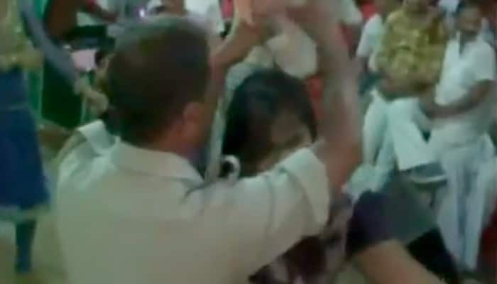 Watch – Policemen in uniform shower money on bar dancers in Varanasi