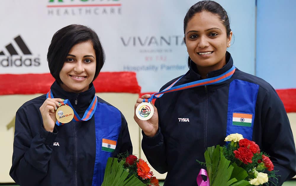 India's Gold medalist Heena Sindhu and Silver Medalist Shweta Sharma during award giving ceremony of Womens 10m Air Pistol in 8th Asian Air Gun Championship in New Delhi.