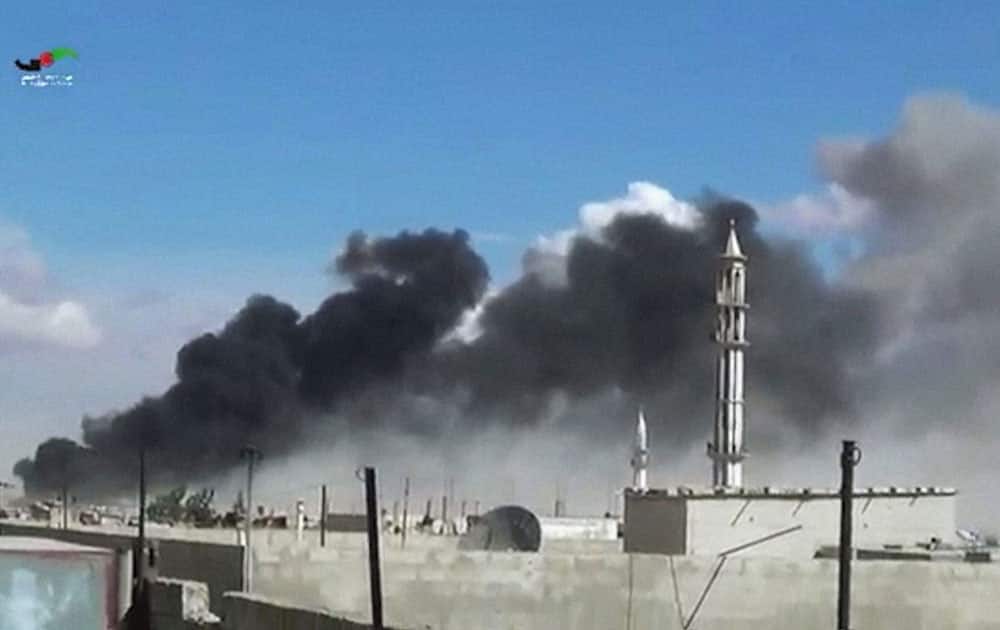 smoke rises after airstrikes by military jets in Talbiseh of the Homs province, western Syria.
