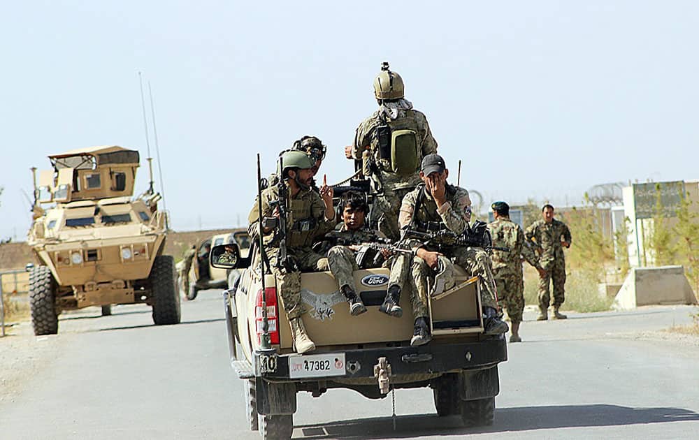National Army soldiers arrive to start an operation soon, outside of Kunduz city, north of Kabul, Afghanistan.