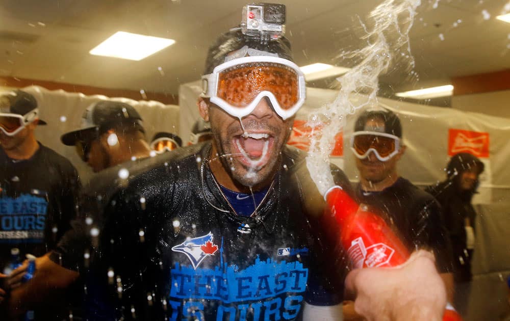 Toronto Blue Jays pitcher David Price celebrates with teammates after the second baseball game of a doubleheader against the Baltimore Orioles in Baltimore. 