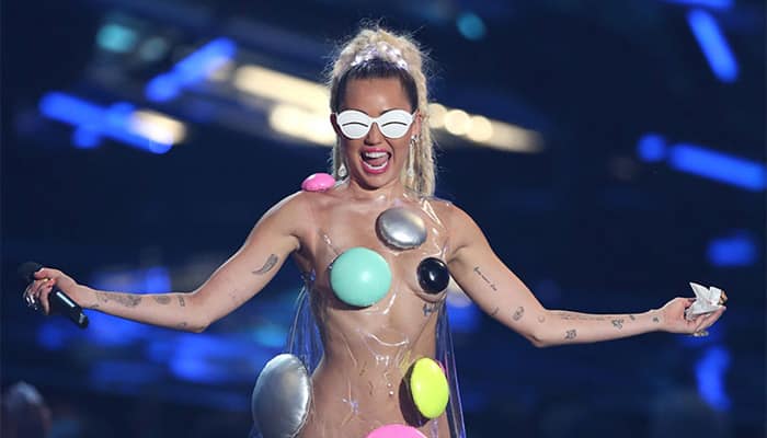 Miley Cyrus flashes skin in bizarre outfit