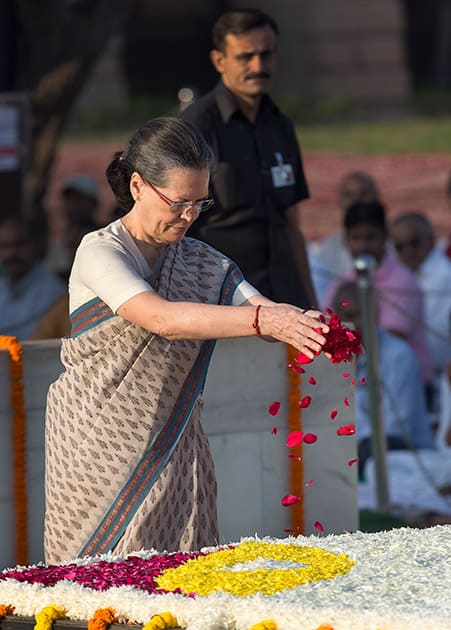 Congress party President Sonia Gandhi offers floral tributes at the memorial of Mahatma Gandhi on the occasion of his birth anniversary, in New Delhi.