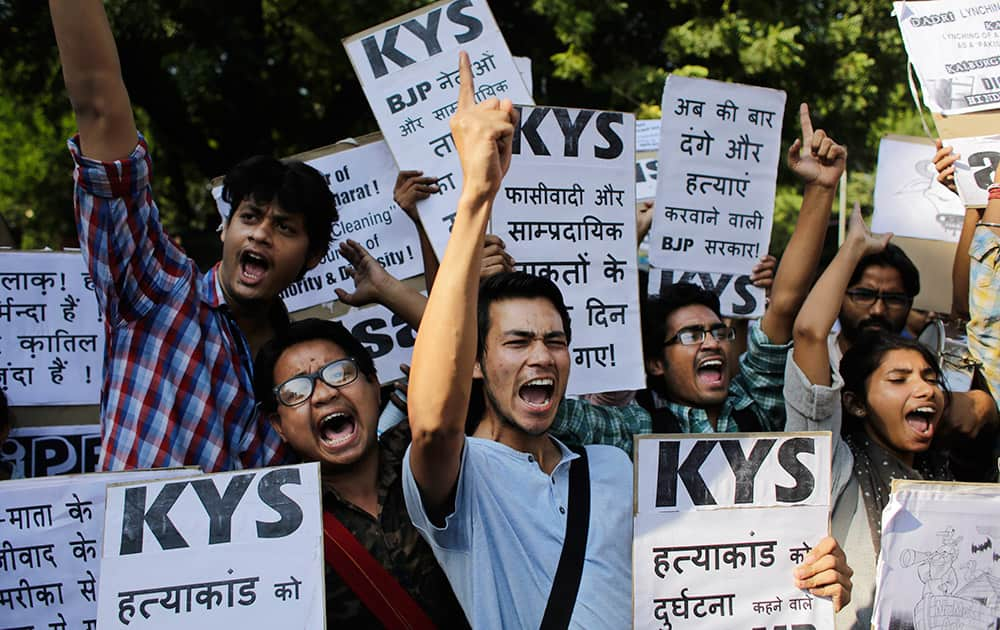 Students unions carry placards denouncing the lynching of a 52-year-old Muslim farmer Mohammad Akhlaq as they shout slogans during a protest in New Delhi.