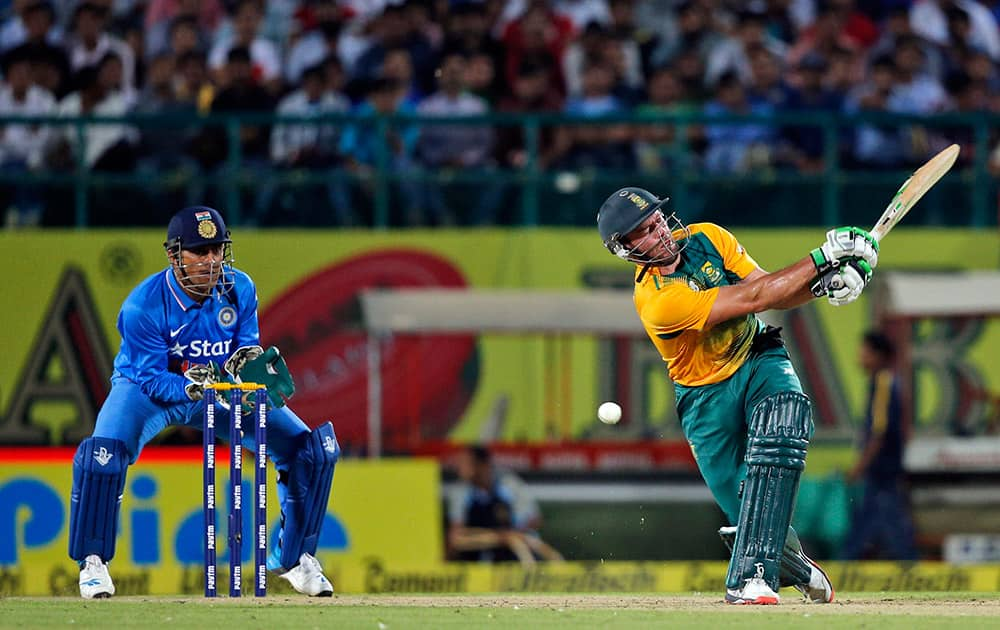 South Africa's AB de Villiers misses the ball to be clean bowled by India's Ravichandran Ashwin during their first Twenty20 cricket match in Dharmsala.