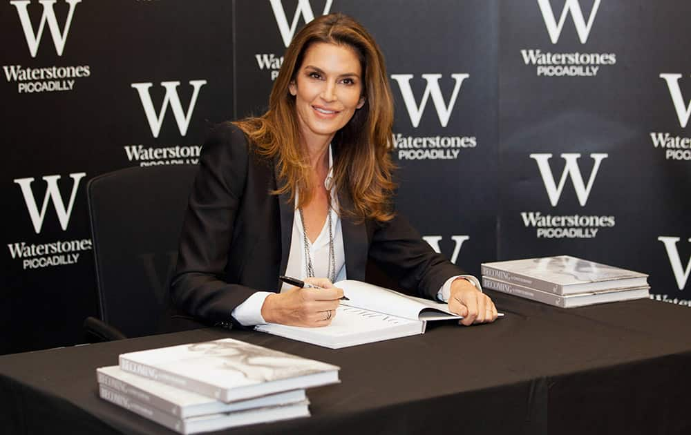 Cindy Crawford poses for photographers at the launch of her new book 'Becoming' in central London.