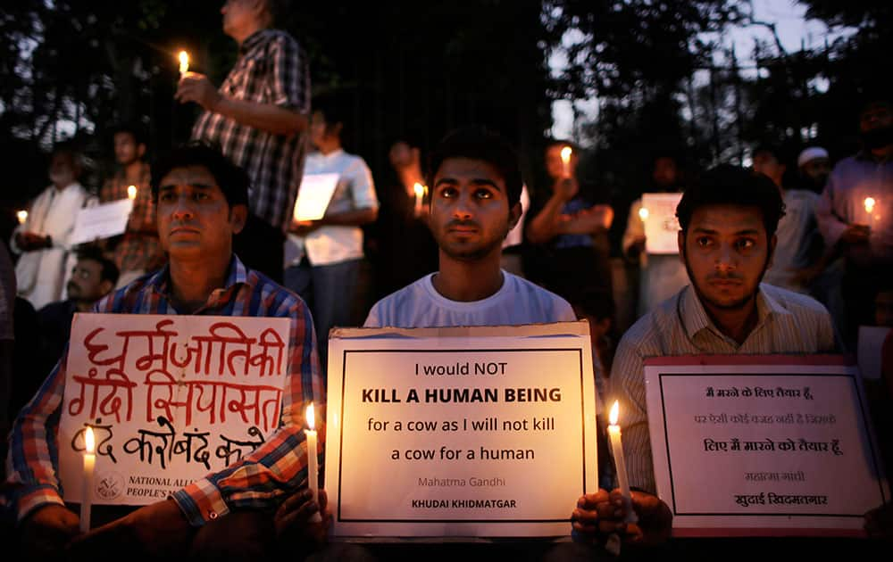 People participate in a candlelight vigil in memory of 52-year-old Muslim farmer Mohammad Akhlaq who was lynched by a mob, in New Delhi.