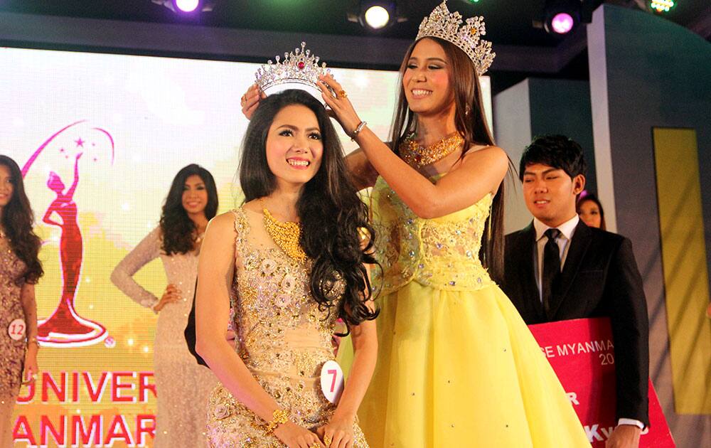 May Barani Thaw, winner of Miss Universe Myanmar 2015 receives her crown from Shar Htut Eaindra, winner of Miss Universe Myanmar 2014, during the Miss Universe Myanmar competition in Yangon, Myanmar.