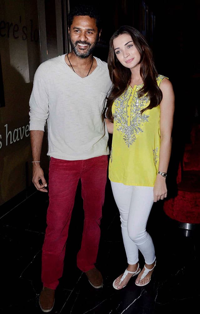 Amy Jackson with Director Prabhudheva during promotion of their film Singh Is Bling in Mumbai.