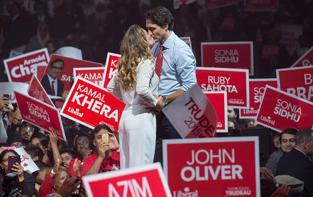 Liberal leader Justin Trudeau kisses his wife Sophie as he takes the stage during a rally in Brampton, Ontario, Canada.