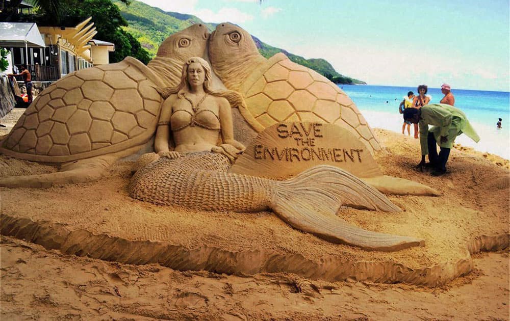 A sand sculpture created by Indian sand artist, Sudarsan Pattnaik with the message Save the Environment during Seychelles India day Celebrations at Beau Vallon Beach in Seychelles.
