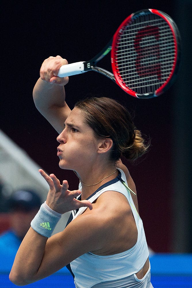 Andrea Petkovic of Germany watches her shot as she plays against Eugenie Bouchard of Canada during their first round of the China Open tennis tournament.