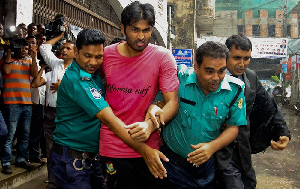 Bangladeshi cricketer Shahadat Hossain is taken away by policemen after he surrendered before a court in Dhaka, Bangladesh. Bangladesh fast bowler Shahadat Hossain was sent to prison on Monday on charges of torturing an 11-year-old housemaid.