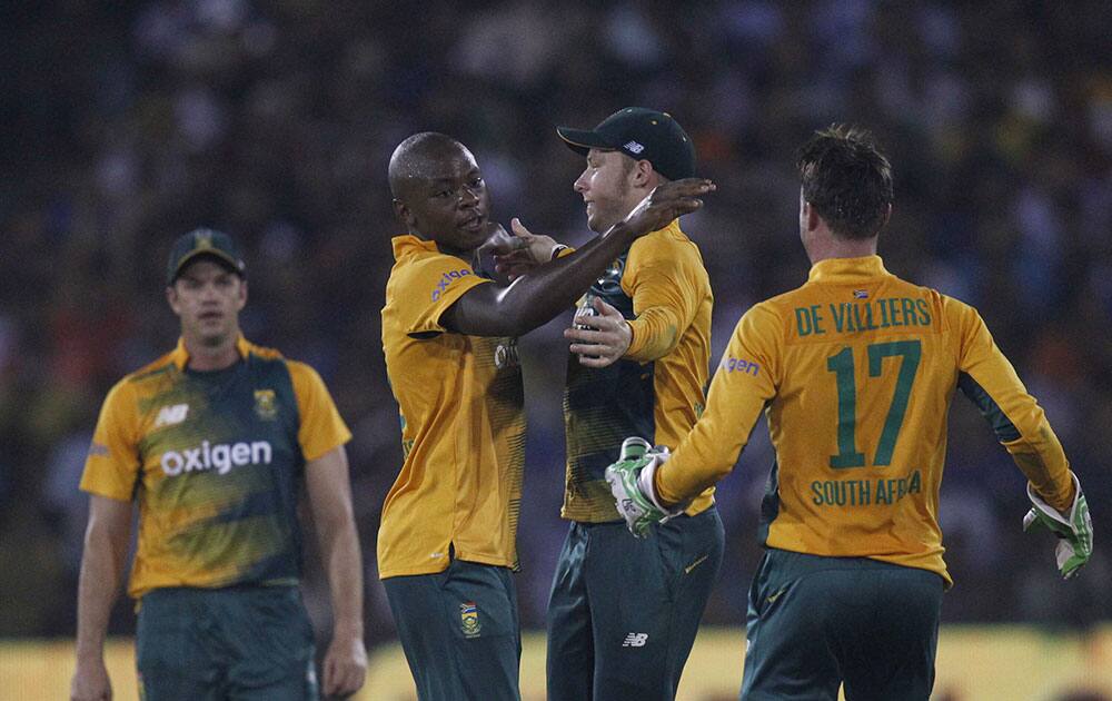 South Africa's Kagiso Rabada celebrates the wicket of India's Ambati Rayudu during their second Twenty20 cricket match in Cuttack.