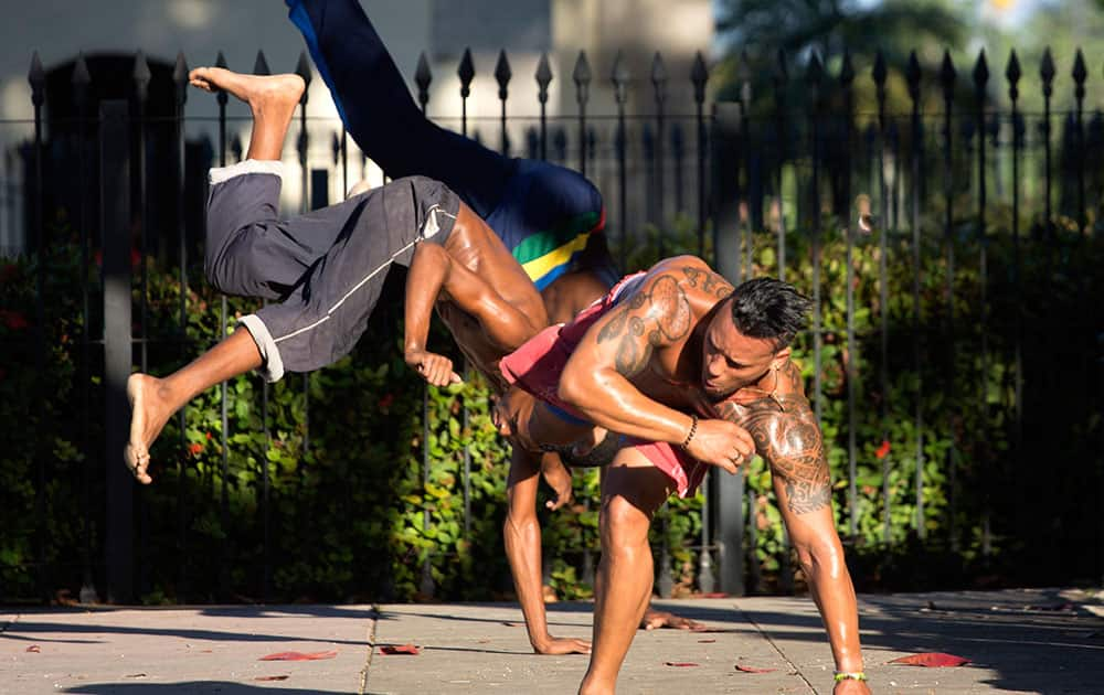 Youths attend a Capoeira lesson on a street in Havana, Cuba.