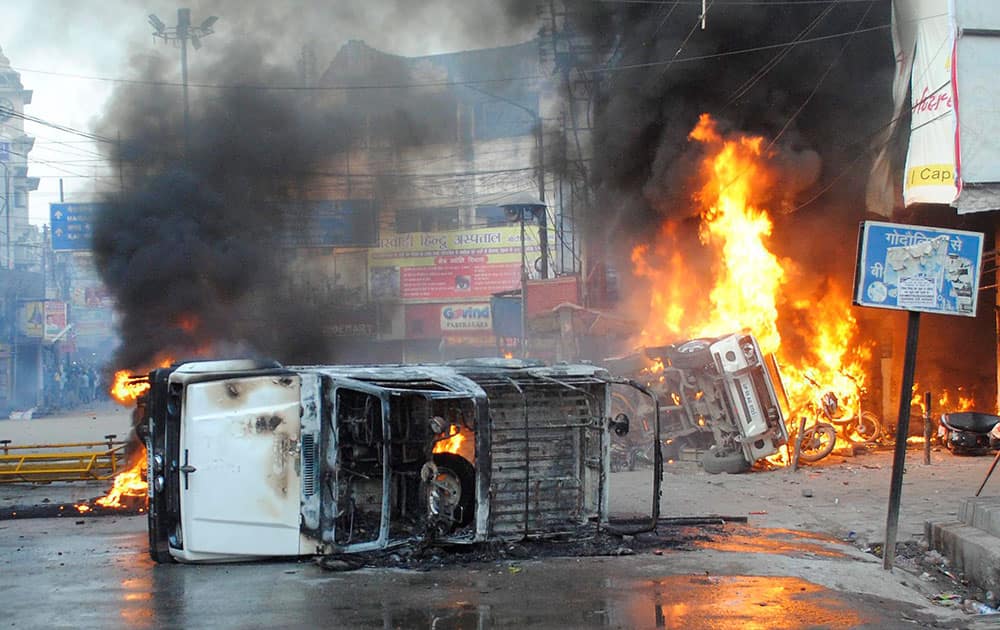 Protesters set affire a police jeep during a clash with the police in Varanasi on Monday. The clashes broke out during a demonstration by the sadhus and devotees against the September 22 police baton-charge on a procession where they were heading to immerse Lord Ganesha’s idol in the Ganga. 