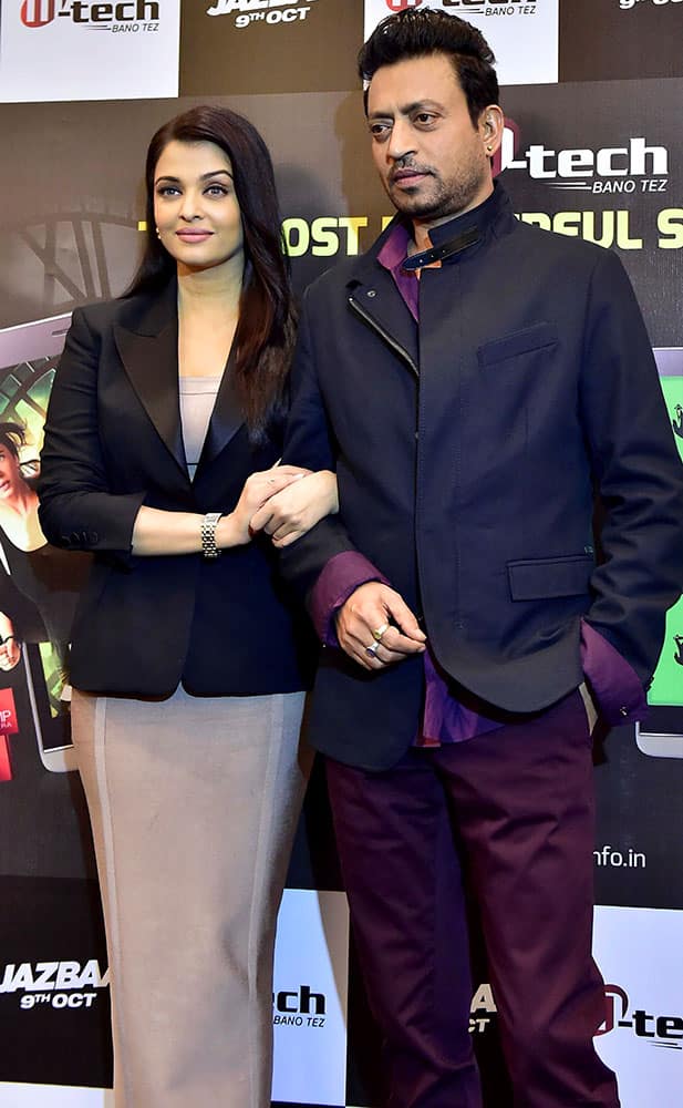 Bollywood actress Aishwarya Rai Bachchan (L) with actor Irrfan Khan during promotion of their upcoming film Jazbaa in New Delhi.
