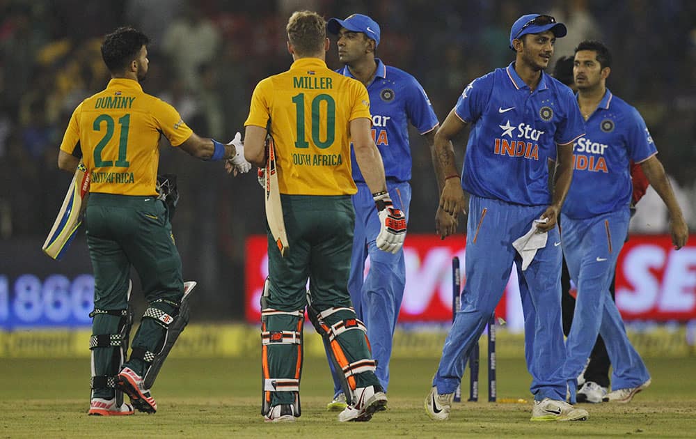 South Africa's Jean-Paul Duminy greets India's Ravichandran Ashwin after winning their second Twenty20 cricket match in Cuttack.