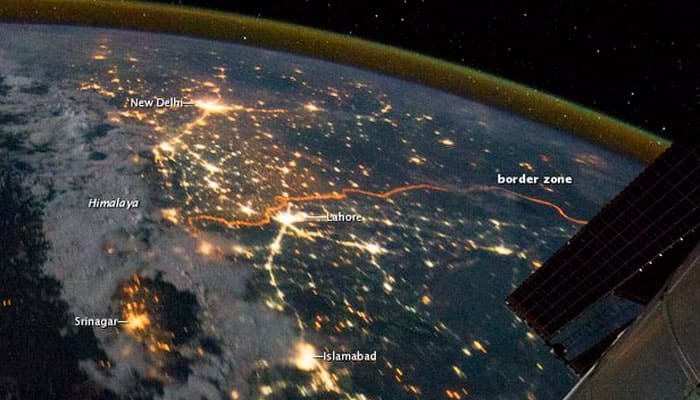 Indo-Pak border: Bright and calm from space...guns on the ground