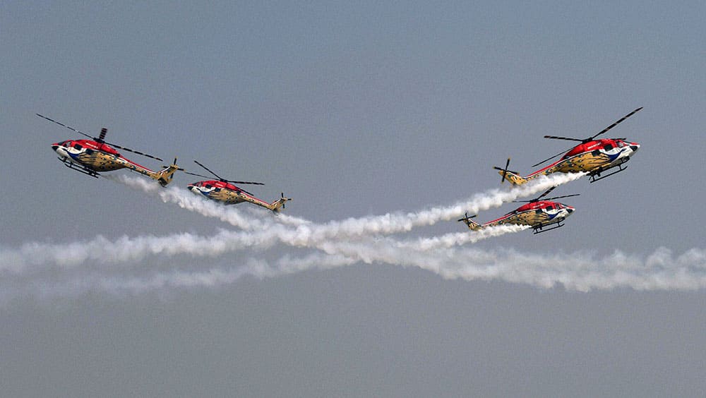 The Sarang Helicopters perform a display during rehearsals ahead of Air Force Day at the air force station in Hindon near New Delhi.