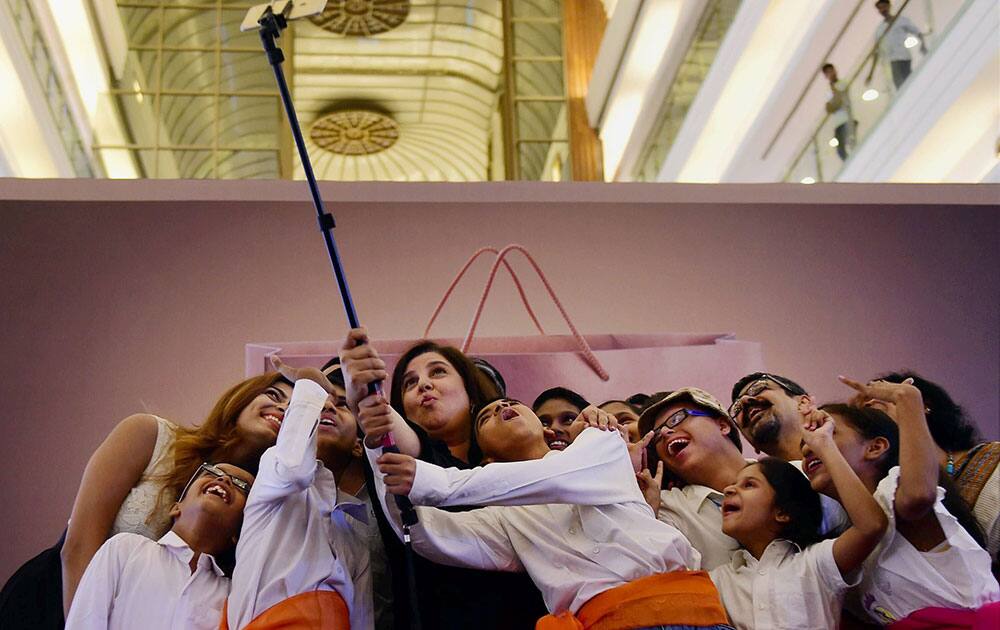 Filmmaker Farah Khan takes a selfie with special children during an event in Mumbai.