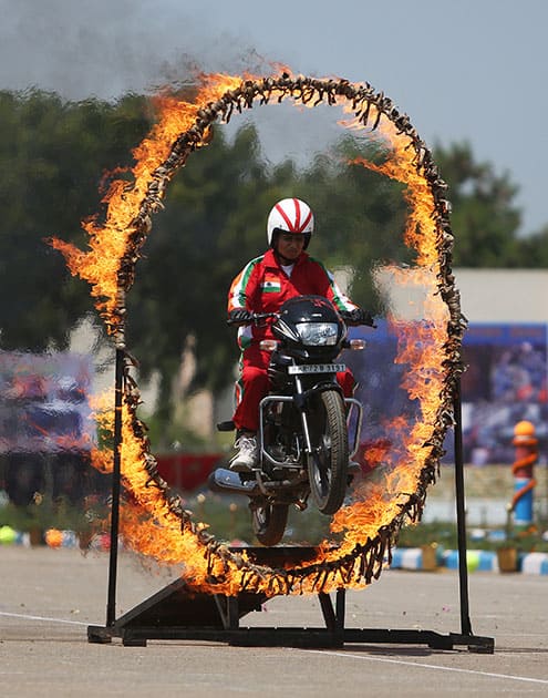 A Rapid Action Force woman soldier displays her skills during their 23rd anniversary celebrations on the outskirts of Hyderabad