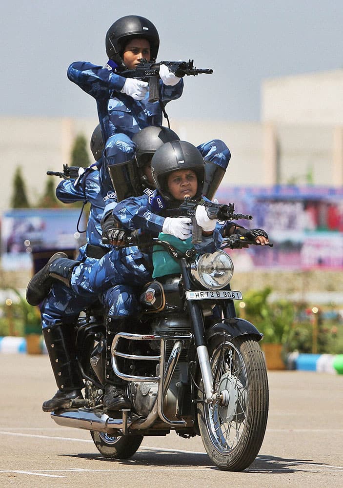 Rapid Action Force women soldiers display their skills during their 23rd anniversary celebrations on the outskirts of Hyderabad.