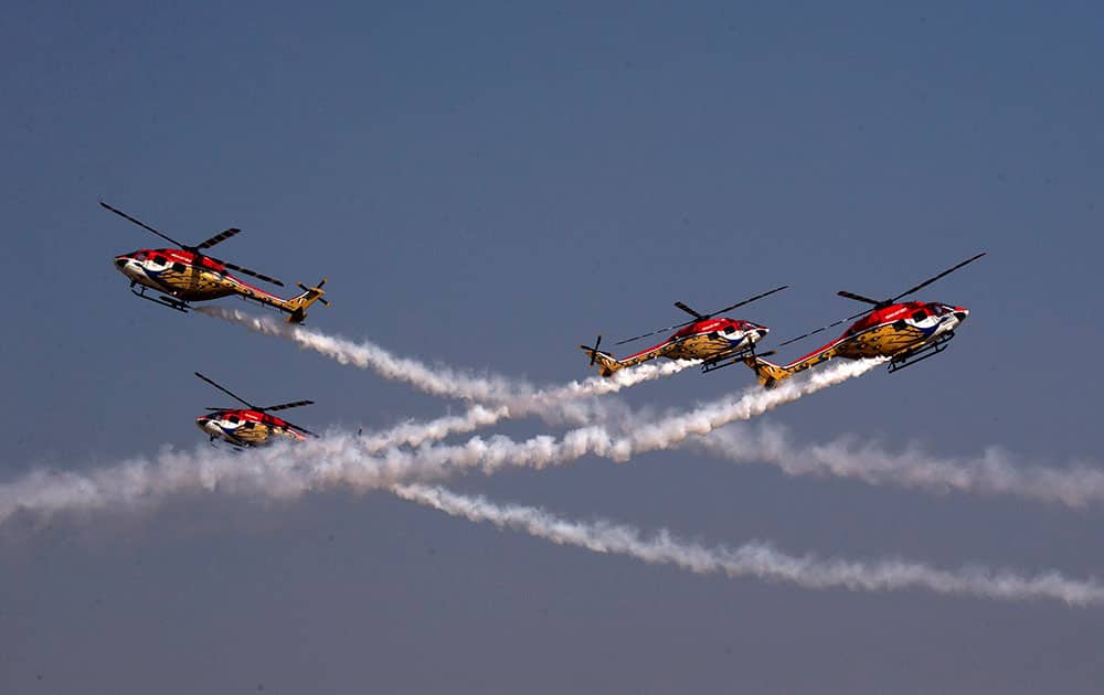 Indian Air Force Sarang Helicopter team display their skill during Air Force Day parade at Hindon Air Force base near New Delhi.