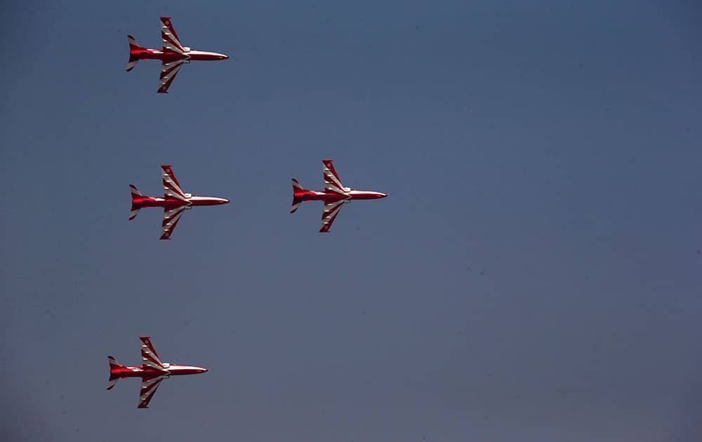 Indian Air Force Suryakirans comprising of four Hawks fly in a formation during Air Force Day parade at Hindon Air Force base near New Delhi.