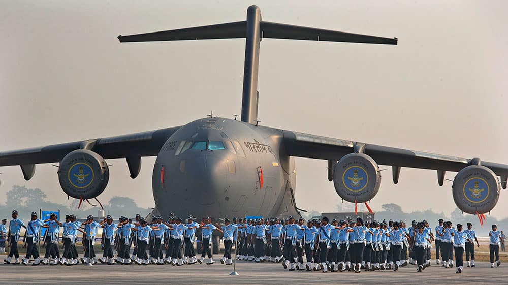 Indian Air Force soldiers march past the IAF C-17 Globemaster during Air Force Day parade at Hindon Air Force base near New Delhi.