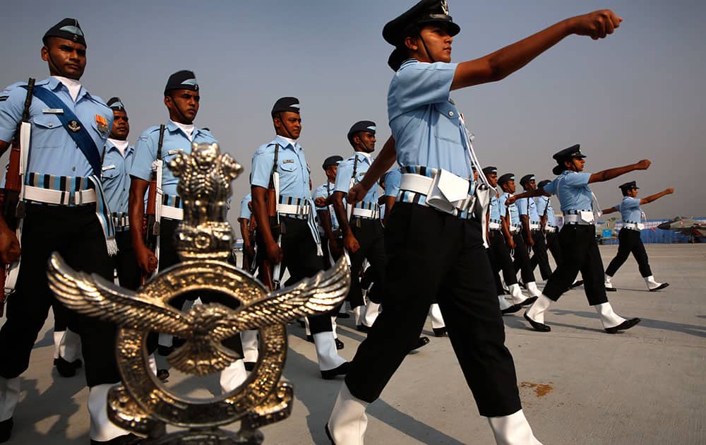 Indian Air Force women officers lead a marching contingent during the Indian Air Force Day parade at Hindon Air Force base near New Delhi.