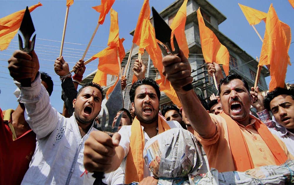 Bajrang Dal activists shout slogans in protest against the Independent MLA Abdul Rasheed for organizing a beef party in Jammu.