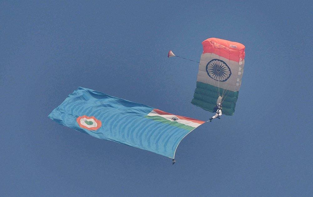 Sky-diving team of Akash Ganga in action during the Air Force Day Parade 2015 at Air Force Station Hindon in Ghaziabad.